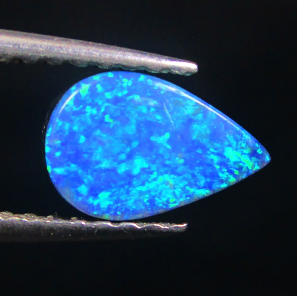 0.95 Ctw Natural Australian Doublet Opal Pear Cabochon: No Reserve! Title: 0.95 Ctw Natural Australian Doublet Opal Pear Cabochon Stone Clarity: Opaque Gemstone:Natural Australian Opal Carat Weight: 0.95 Size/Dimensions: 8.30 x 5.40 x 2.50 mm Additional In