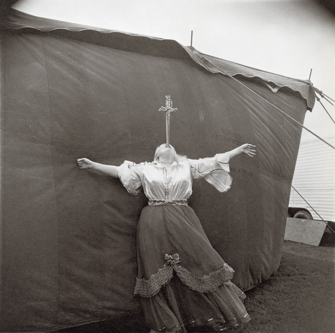 DIANE ARBUS - Sword Swallower At A Carnival, MD, 1970: Artist: Diane Arbus Title: Albino Sword Swallower At A Carnival, MD, 1970 Medium: Photo Litho, 1972, USA Dimensions: 8.3x8.25" Description: Heat Wax Mounted on 11x14" Conservation Board Artist Bio: Di