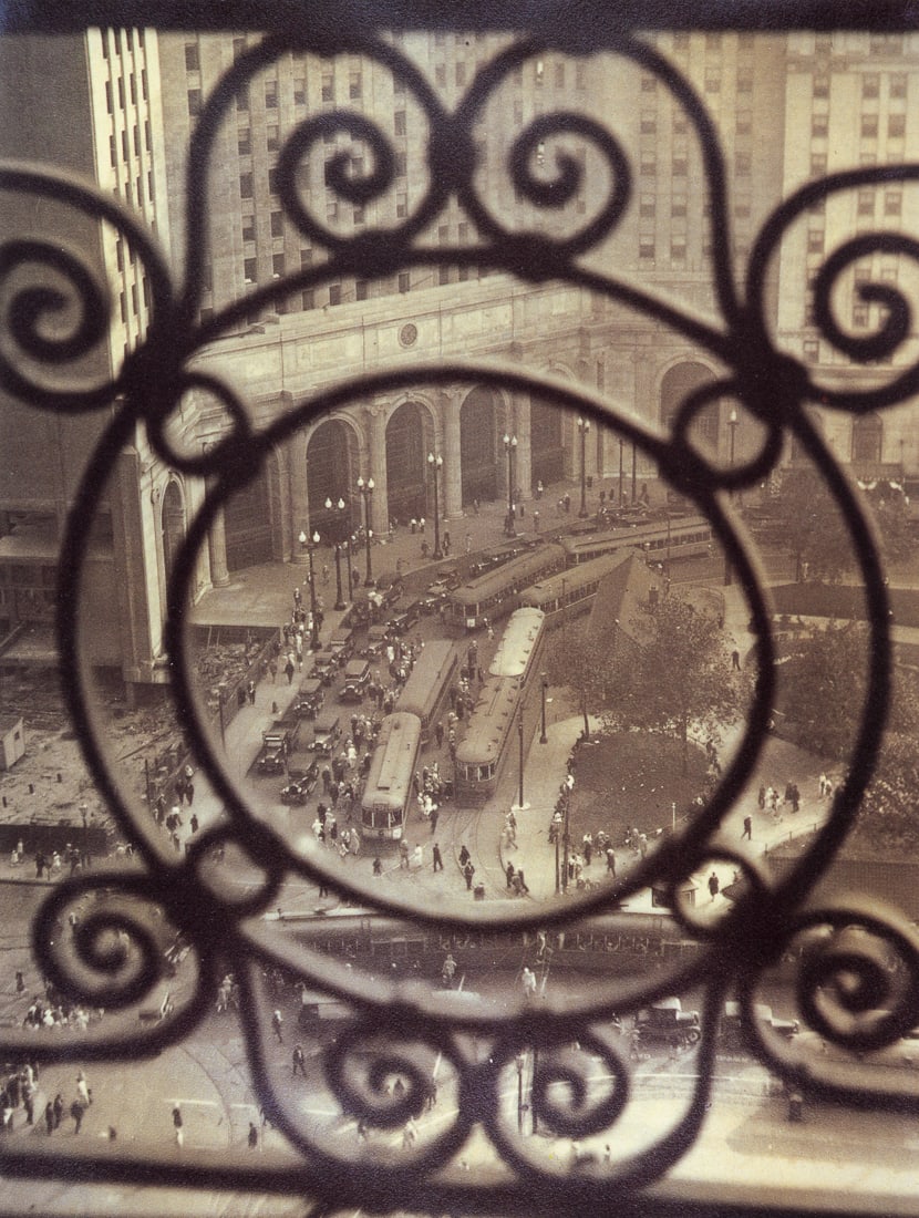 MARGARET BOURKE-WHITE - Public Square, Terminal Tower: Artist: Margaret Bourke-White Title: Public Square (The Terminal Tower) at 5:00. Seen Through a Williamson Building Grille, Cleveland, 1928 Medium: Photo Litho, 1988, England Dimensions: 7.55x10" Desc
