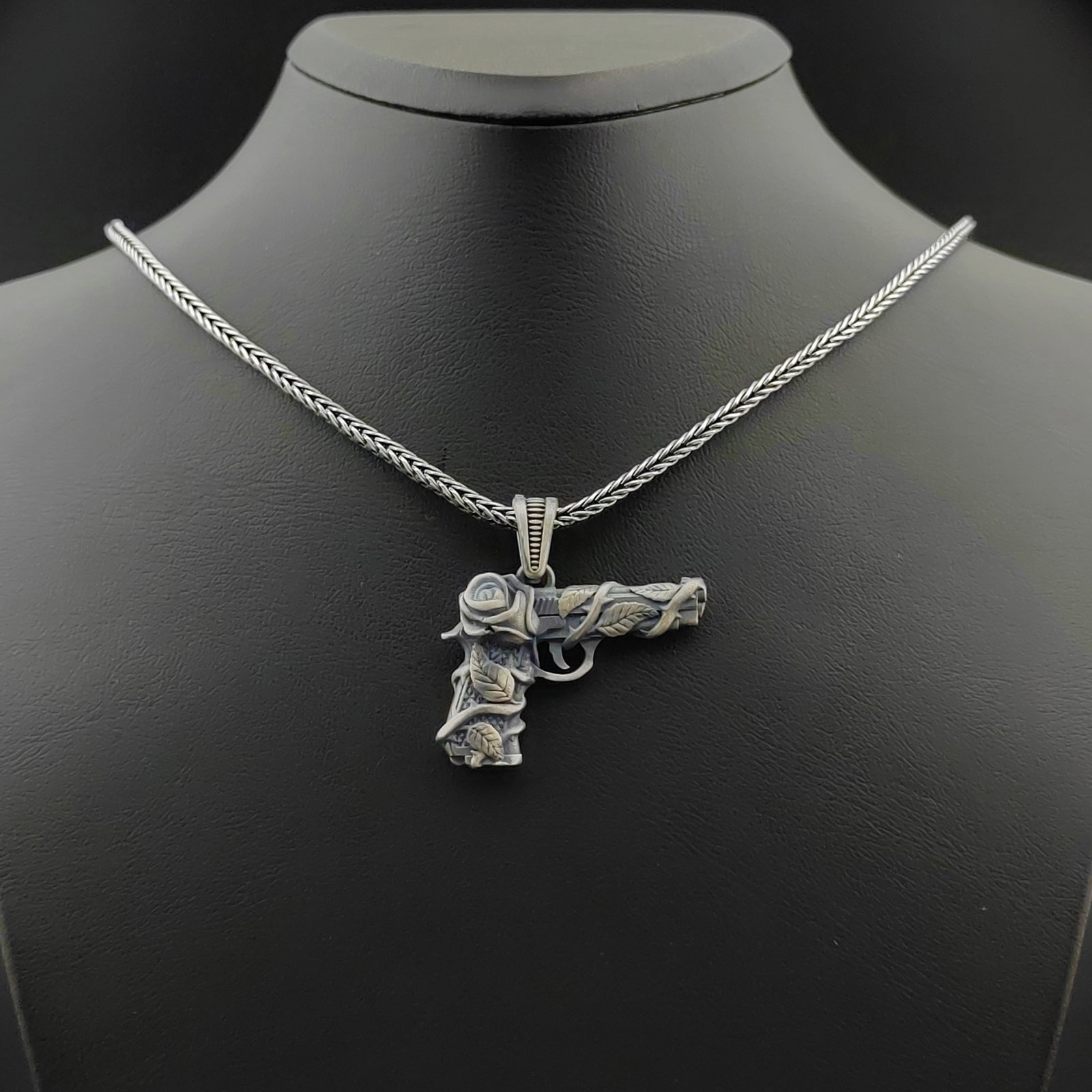 925 Silver Chain with Gun Pendant: 925 Silver Chain with Gun Pendant -Condition:New -Total Weight:25.5g Chain Size: 23.62 in(60cm). Pendant Size:1.25x1.33 in (32x34mm) (Bail included). With Gift Box Express Shipping.Carrier:DHL Express