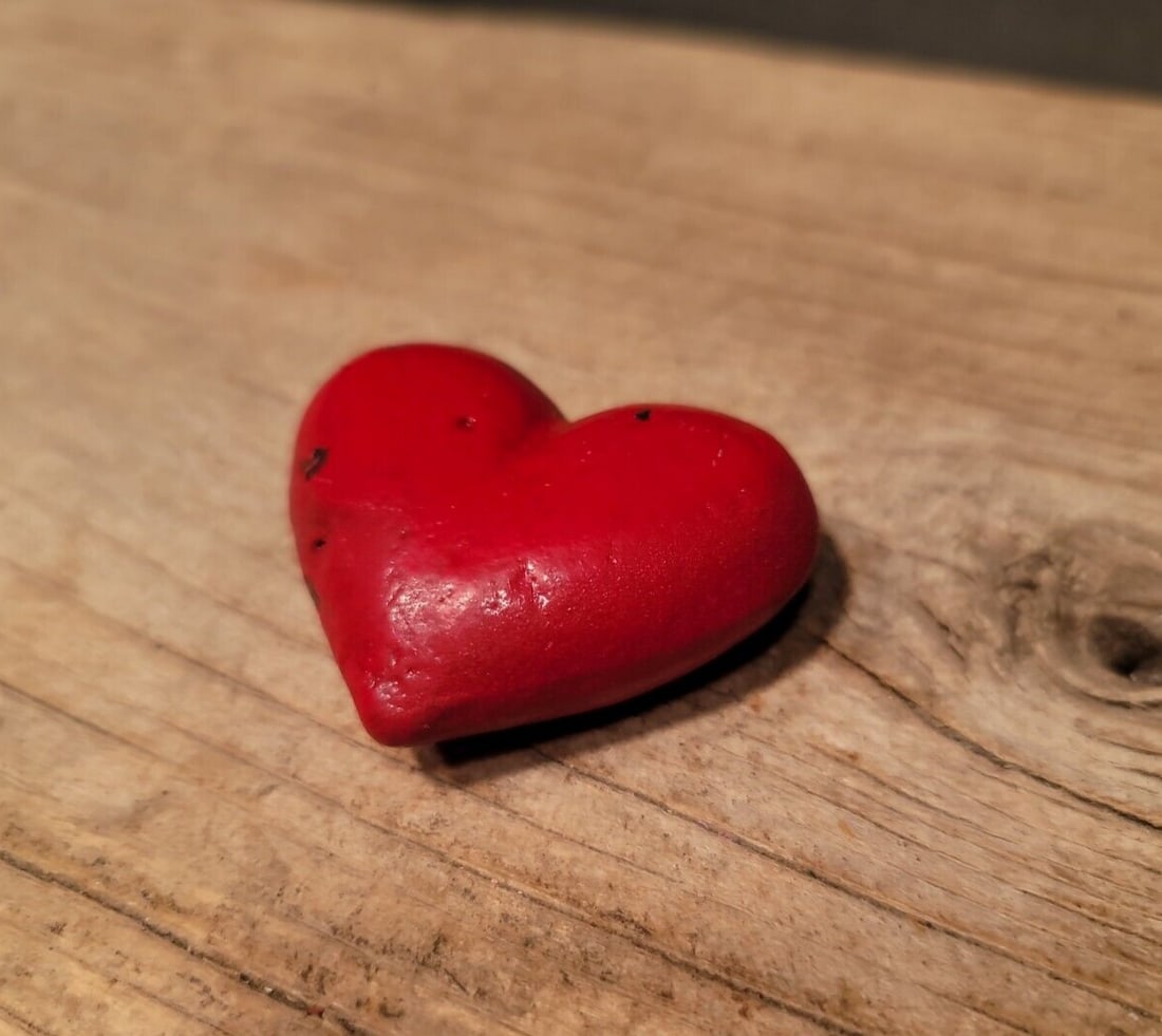 Cast Iron Heart: 1 7/8" Wide 1 3/4" tall A wonderful reproduction cast iron heart. Many times the symbol of a heart in an open palm is symbolic of an open welcome or charity. It has also been the symbol of the The Ind