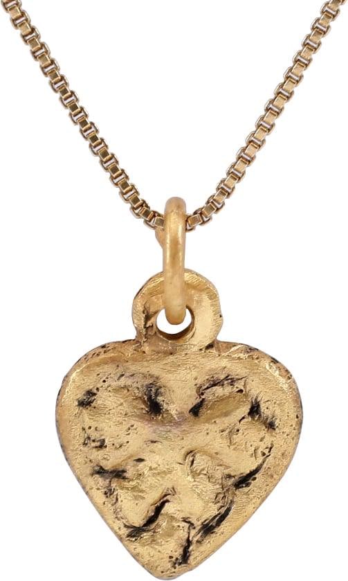 FINE VIKING HEART PENDANT PENDENT C.10TH-11TH CENTURY AD: 16.8mm, 0.66" total height. Elegant form with rudimentary cusp to the top and pointed bottom. Thick with a broad rounded edge and high relief, well delineated, central pentafoil. Made by the open face