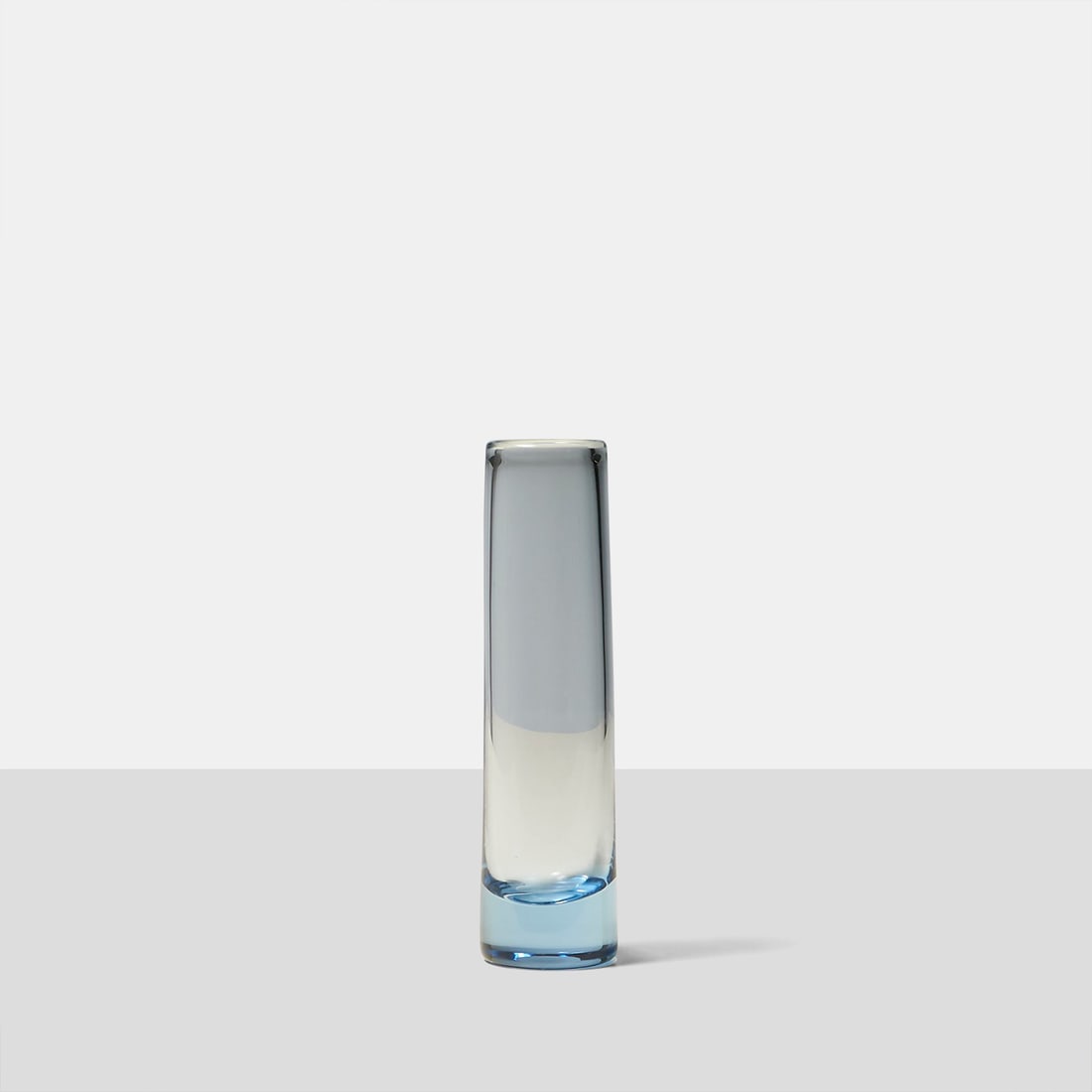 Vase by Per Lutken: Title: Vase by Per Lutken Maker: Holmegaard Origin: Denmark Date/Period: c1960s Materials: Glass Size:9.5"h x 2.5"dia Description: An aqua blown glass vase designed by Per Lutken for Holmegaard. Etche