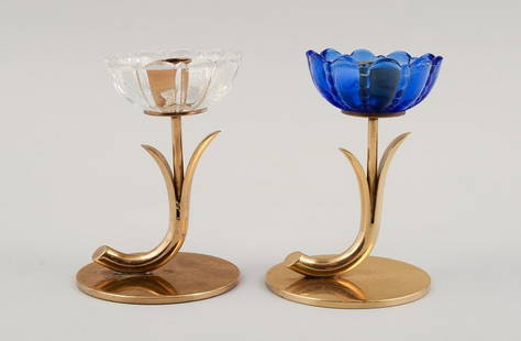 Gunnar Ander for Ystad Metall. Two candlesticks in brass and blue/white art glass shaped like: Title: Gunnar Ander for Ystad Metall. Two candlesticks in brass and blue/white art glass shaped like flowers. The 1950s.Description: Gunnar Ander for Ystad Metall. Two candlesticks in brass and