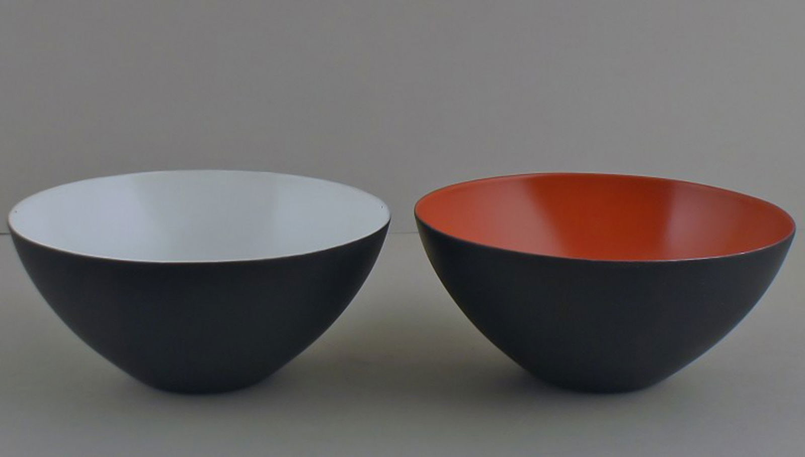 Krenit bowls by Herbert Krenchel. 2 pcs. in stock.: Title: Krenit bowls by Herbert Krenchel. 2 pcs. in stock. Description: Here you are offered 2 Krenit bowls by Herbert Krenchel. Black metal and white and orange enamel. 1970s. Size: 9 cm. tall. 16 cm.