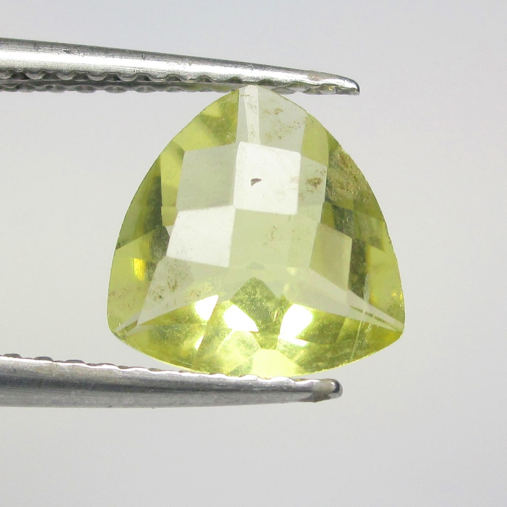 1.39 Ctw Natural Lemon Quartz Trillion Cut: No Reserve! Title: 1.39 Ctw Natural Lemon Quartz Trillion Cut Stone Clarity: VVS Gemstone:Natural Lemon Quartz MCarat Weight: 1.39 Size/Dimensions: 8.40 x 8.30 x 4.50 mm Additional Info:Good Luster / 