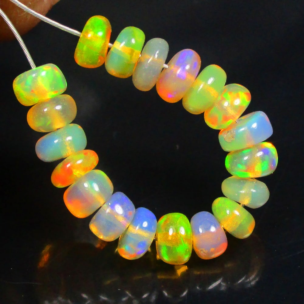 3.30 Ctw Natural 19 Drilled Multi-Color Fire Opal Round Beads: No Reserve! Title: 3.30 Ctw Natural 19 Drilled Multi-Color Fire Opal Round Beads Stone Clarity: Transparent Gemstone:Natural Opal Beads MCarat Weight: 3.3 Size/Dimensions: 3.70 - 4.10 mm / 19 Pc's Add