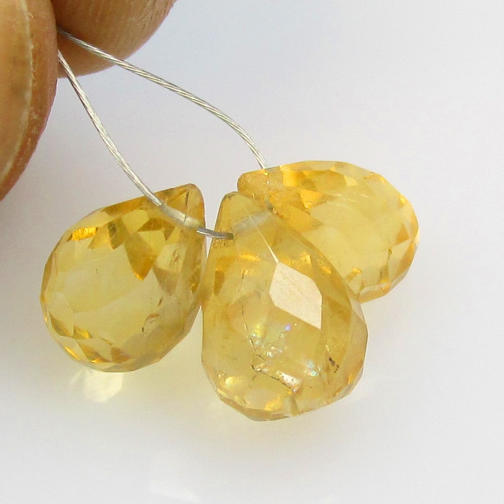 8.12 Ctw Natural 3 Citrine Drilled Pear Drop Beads: No Reserve! Title: 8.12 Ctw Natural 3 Citrine Drilled Pear Drop Beads Stone Clarity: Transparent Gemstone:Natural Citrine Beads MCarat Weight: 8.12 Size/Dimensions: 10.0x6.7 - 10.8x7.4 mm / 3 Pc's Add