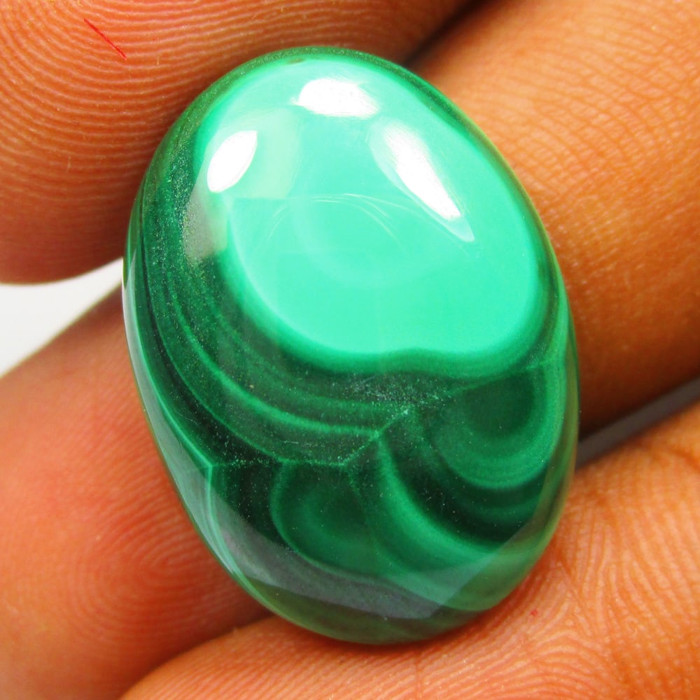 23.27 Ctw Natural Malachite Oval Cab: No Reserve! Title: 23.27 Ctw Natural Malachite Oval Cab Stone Clarity: Opaque Gemstone:Natural Malachite MCarat Weight: 23.27 Size/Dimensions: 23.00 x 15.70 x 5.90 mm Additional Info:Excellent Oval Ca