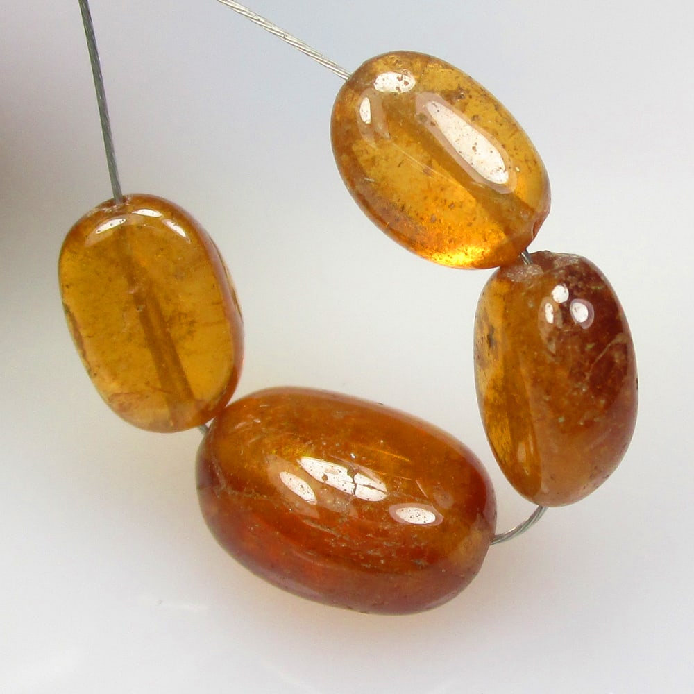 11.00 Ctw Natural 4 Hessonite Garnet Dumble Beads: No Reserve! Title: 11.00 Ctw Natural 4 Hessonite Garnet Dumble Beads Stone Clarity: Transparent Gemstone:Natural Hessonite Garnet Beads MCarat Weight: 11 Size/Dimensions: 5.8x3.5- 8.0x3.9 mm / 4 Pc's 