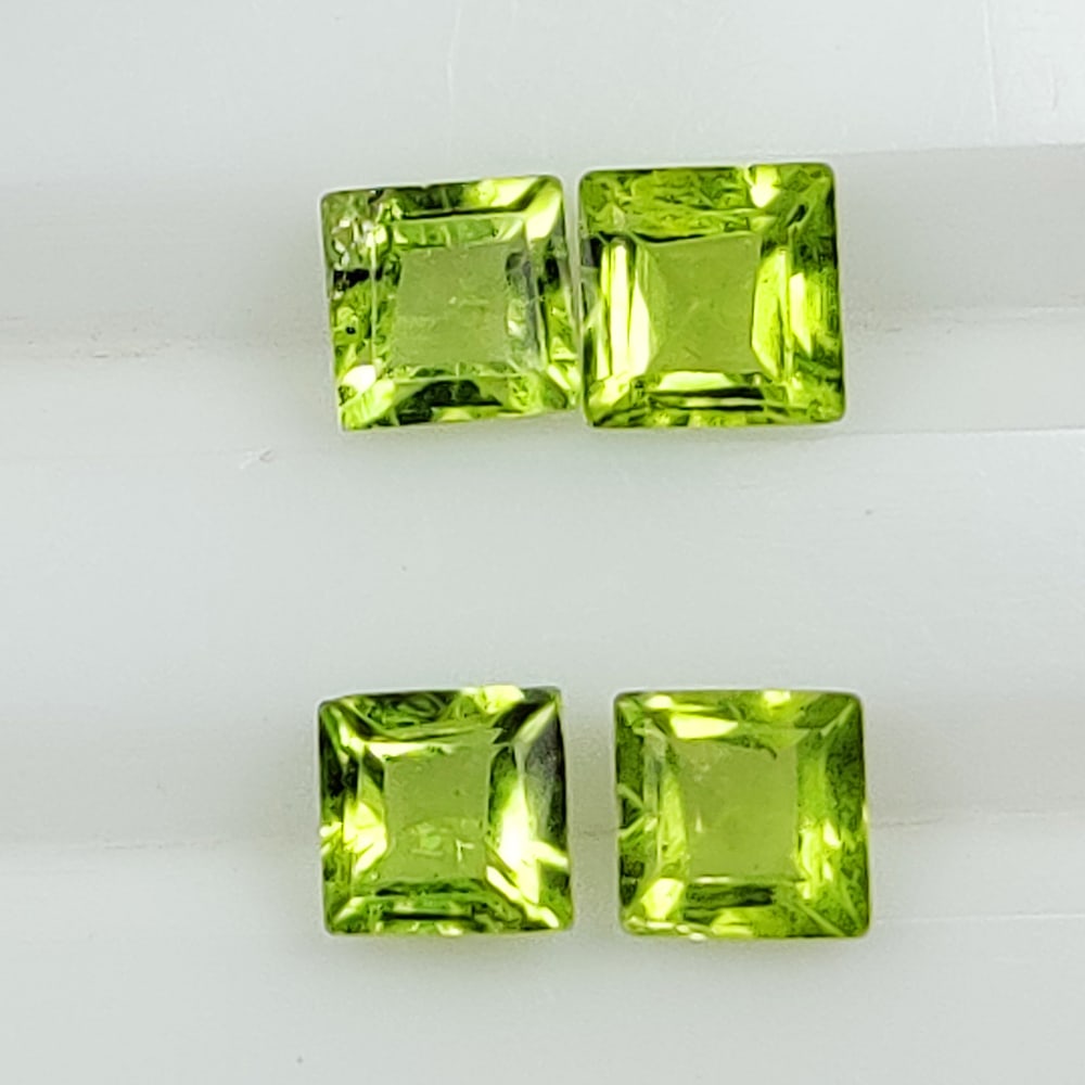 2.14 Ctw Natural Pakistan Peridot Square Set: No Reserve! Title: 2.14 Ctw Natural Pakistan Peridot Square Set Stone Clarity: VVS Gemstone:Natural Peridot Carat Weights: 2.14 Size/Dimensions: 4.1x4.1 - 4.4x4.4 mm / 4 Pc's Additional Info:Top Class