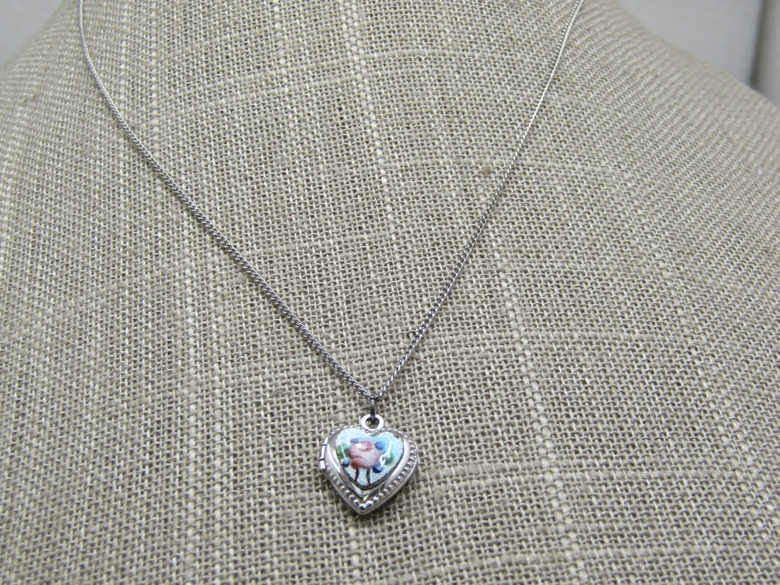 Vintage Sterling Heart Guilloche Rose Locket Necklace, 16": Vintage Sterling Guilloche Heart Rose Locket Necklace, 16", 2.62gr. Signed with an M inside a diamond shape on the spring clasp and marked sterling and tested. The pendant with bail and jump ring is 5