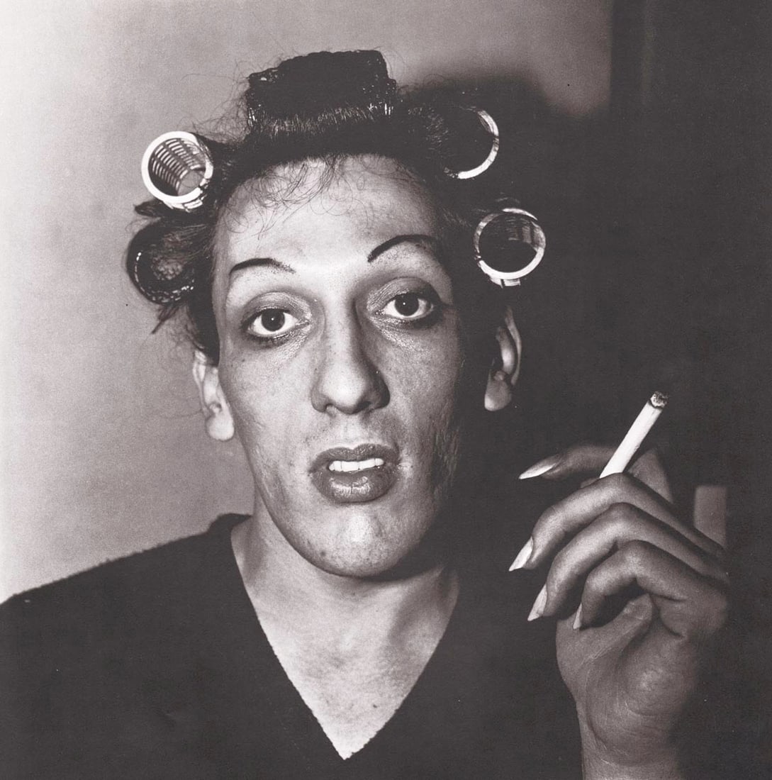 DIANE ARBUS - Young Man in curlers at home on West 20th St, NYC, 1966: Artist: DIANE ARBUS Print Title: Young Man in curlers at home on West 20th St, NYC, 1966 Medium: Authentic Vintage Photoengraving Printed 1970’s in the US Image size (inches) approx. 8 x 8&rdquo
