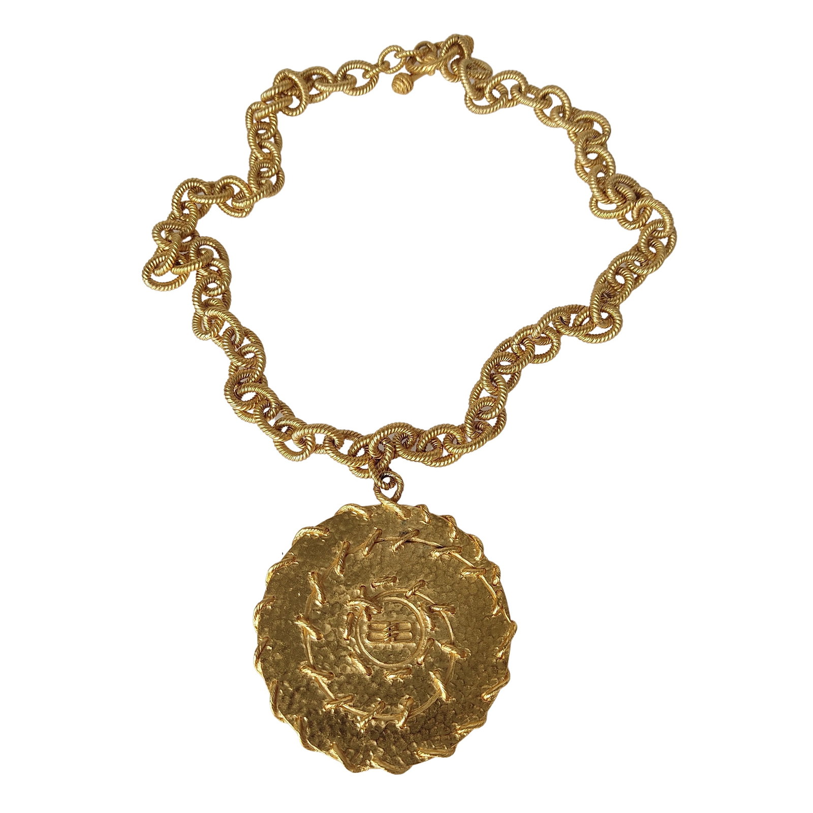 BALENCIAGA Golden metal necklace: Title: BALENCIAGA Golden metal necklace Materials: Metal Measurements/Size: N/A Description: (5030). Balenciaga necklace in satin gold metal. Composed of a large mesh chain and a large medallion with 