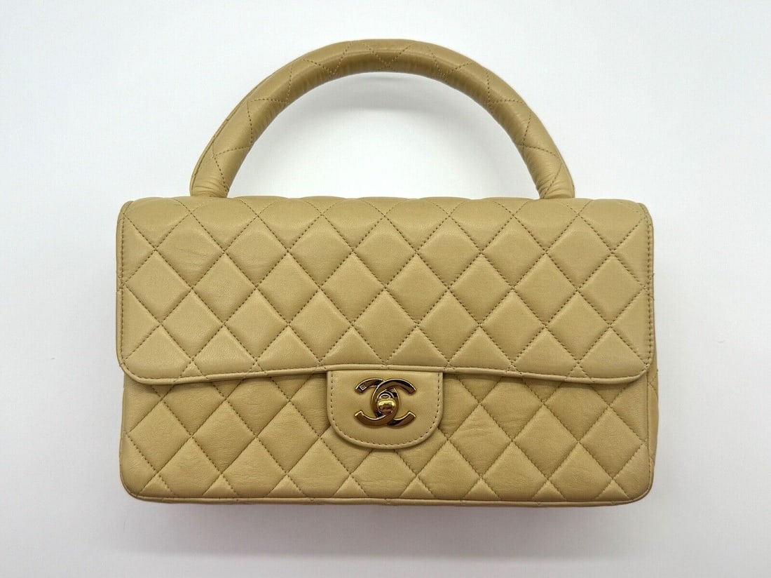 Chanel Kelly Bag 24K Hardware: 100% Authentic RARE vintage CHANEL Kelly “parent-child” or “twin” bag in a rich beige tan lambskin leather with 24k gold-plated hardware. Serial Number: 2924292 Year Of Manufac
