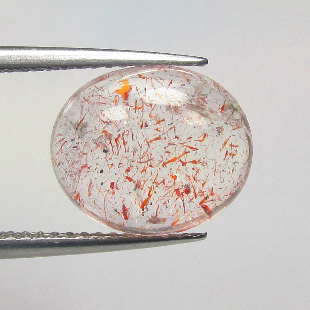 5.40 Ctw Natural Rutile Quartz Oval Cab: No Reserve! Title: 5.40 Ctw Natural Rutile Quartz Oval Cab Stone clarity: Transparent Gemstone:Natural Rutile Quartz Carat weights: 5.4 Size/Dimensions: 11.70 x 10.00 x 6.20 mm Additional info:Excelle