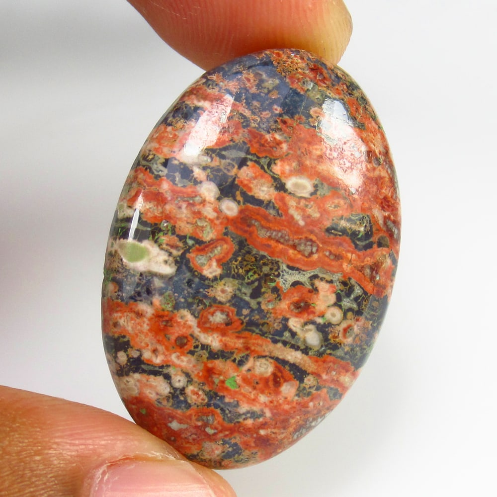 31.40 Ct - Natural Obsidian: No Reserve! Title: 31.40 Ct - Natural Obsidian Description: Gemstone Gemstones:- Carat Weights: Obsidian Size/Dimensions: 31.4 Additional Info:Pieces : 1 No's / Shape : Oval Cab / Color : Multicolor /