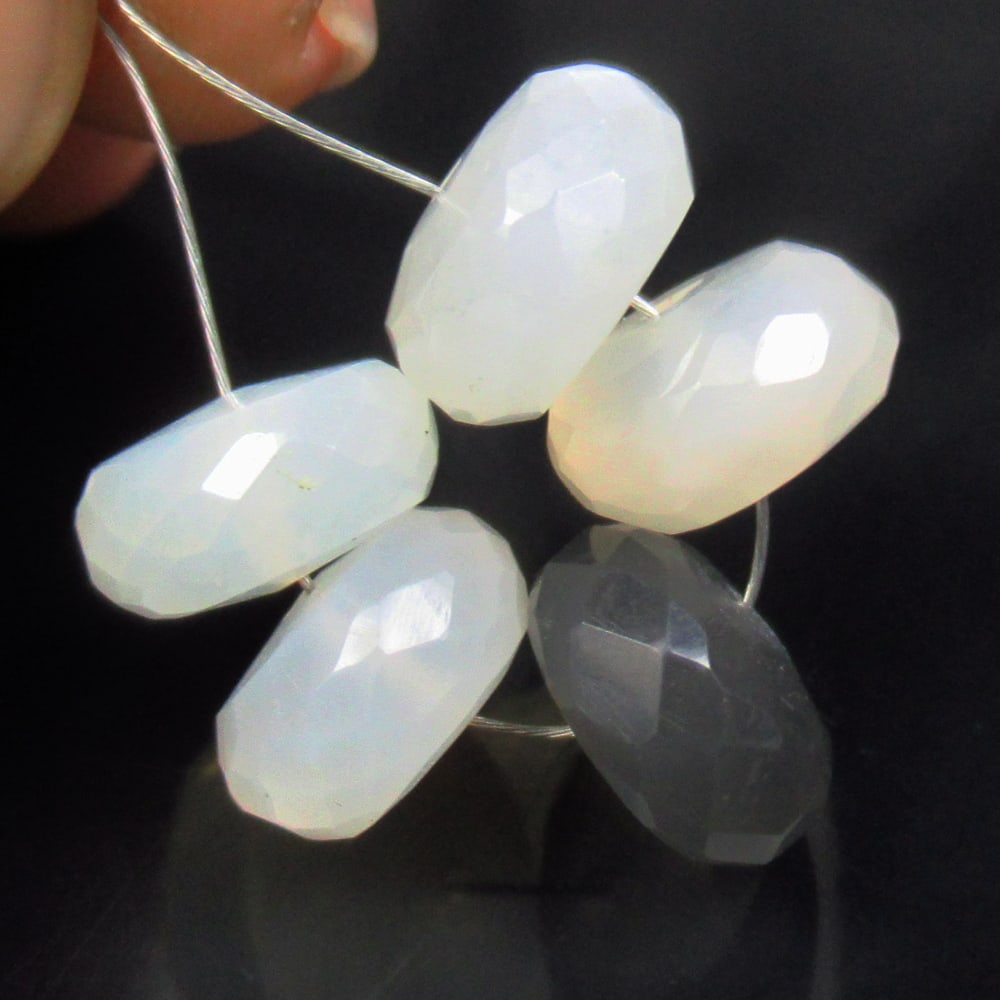 18.44 Ct Natural 5 Drilled Moonstone Round Beads: No Reserve! Title: 18.44 Ct Natural 5 Drilled Moonstone Round Beads Stone clarity: Semi-Transparent Gemstone:Natural Moonstone Beads Carat weights: 18.44 Size/Dimensions: 9.60 to 9.70 mm / 5 PC's Desc