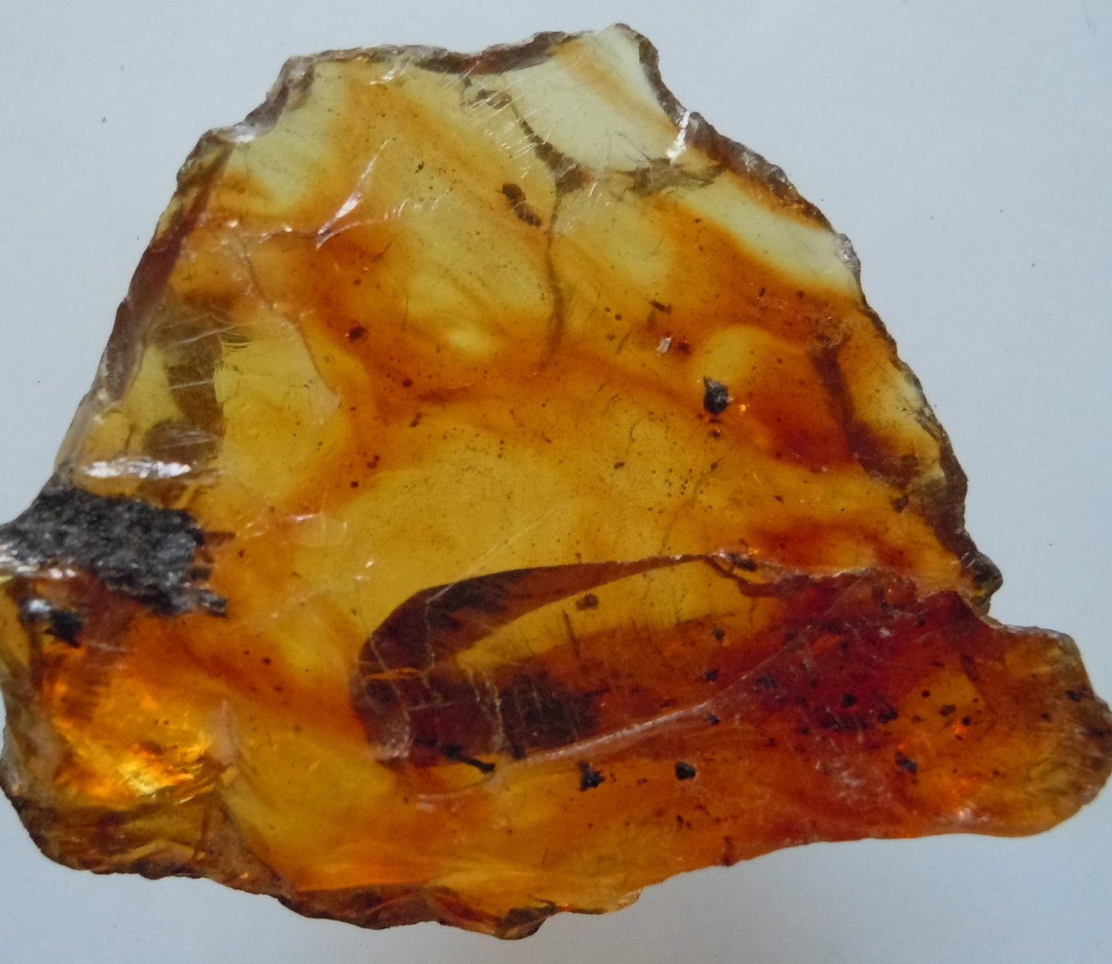 4.64 Gram 100 Mill. Years Old Rough Burmite Amber: Title: 4.64 Gram 100 Mill. Years Old Rough Burmite Amber Origin: Hukawang Valley, Kachin State, Myanmar Size: 3.5x3x1.5 cm / 4.64 Gram Description: yellow to orange transparent rough burmite amber wit