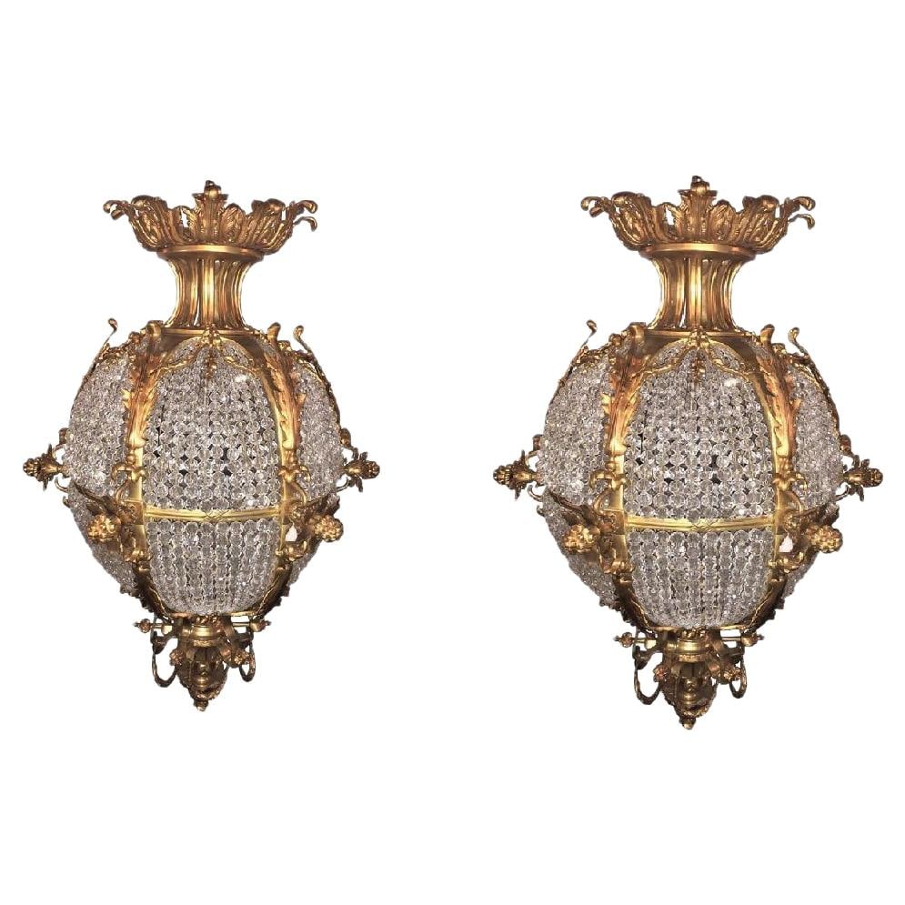 Pair of Palatial Doré Bronze Circular Crystal Beaded Ball Chandeliers: Title: Pair of Palatial Doré Bronze Circular Crystal Beaded Ball Chandeliers Description: A pair of doré bronze circular crystal beaded ball chandeliers. Each of these palatial round chandel