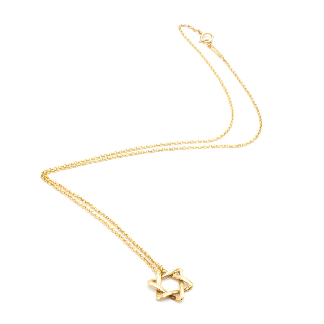 Tiffany & Co David Star 18K necklace: Beautiful Tiffany & Co. necklace. - In 18-carat yellow gold. - Features a beautiful openwork star. - Width of motif: approx. 12mm. - Total weight: 2.2g. - On an 18K gold chain signed Tiffany. - Signed