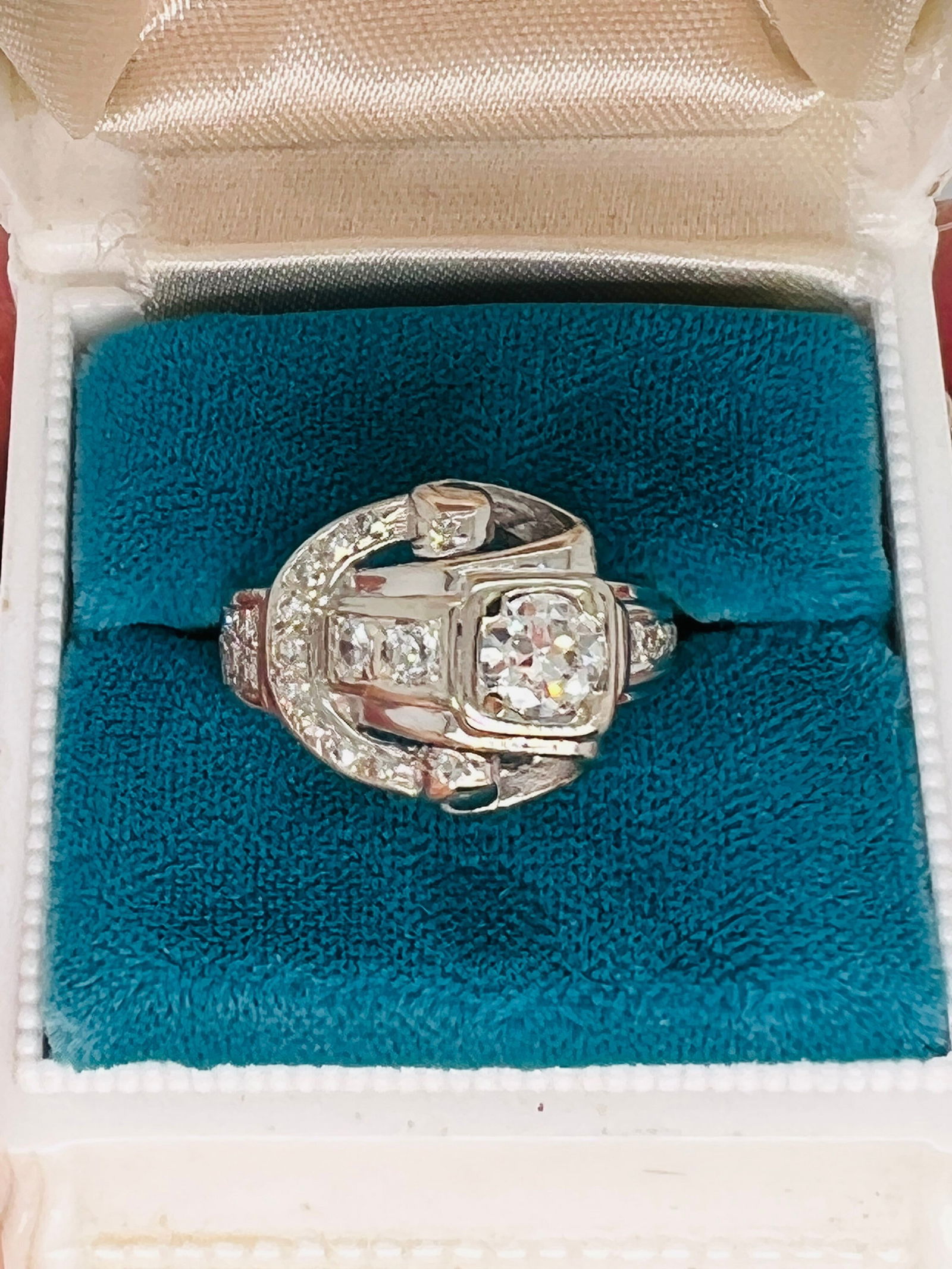 14k Antique diamond buckle ring: Vintage from the 1940s Size: 6 US Materials: White gold Gemstone: Diamond Adjustable Style: Art deco Antique Art deco solid 14kt white gold diamond buckle ring with .75 tcw H color vs 2 diamonds. Cent