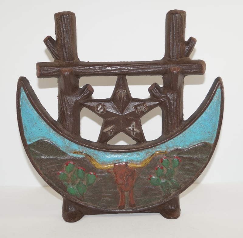 Texas Centennial Cast Iron Doorstop 1936: Title: Texas Centennial Cast Iron Doorstop 1936 Dimension: 9 ¾” tall x 9 ¾” wide. Date: Ca. 1936. Additional Information: Most desirable Antique doorstop depicting “Texas&#