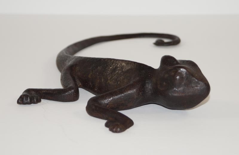 Advertising Chameleon Cast Iron Doorstop: Title: Advertising Chameleon Cast Iron Doorstop Dimension: N/A Date: Ca. 1900-20’s. Additional Information: Full-figure, solid casting of an Advertising Chameleon Antique Doorstop. On the unders