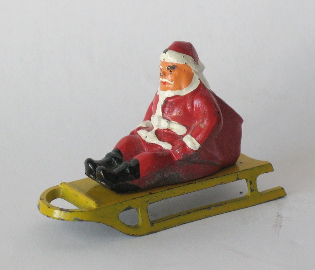 Antique cast lead Santa Clause on sled figure. (1 of 4)