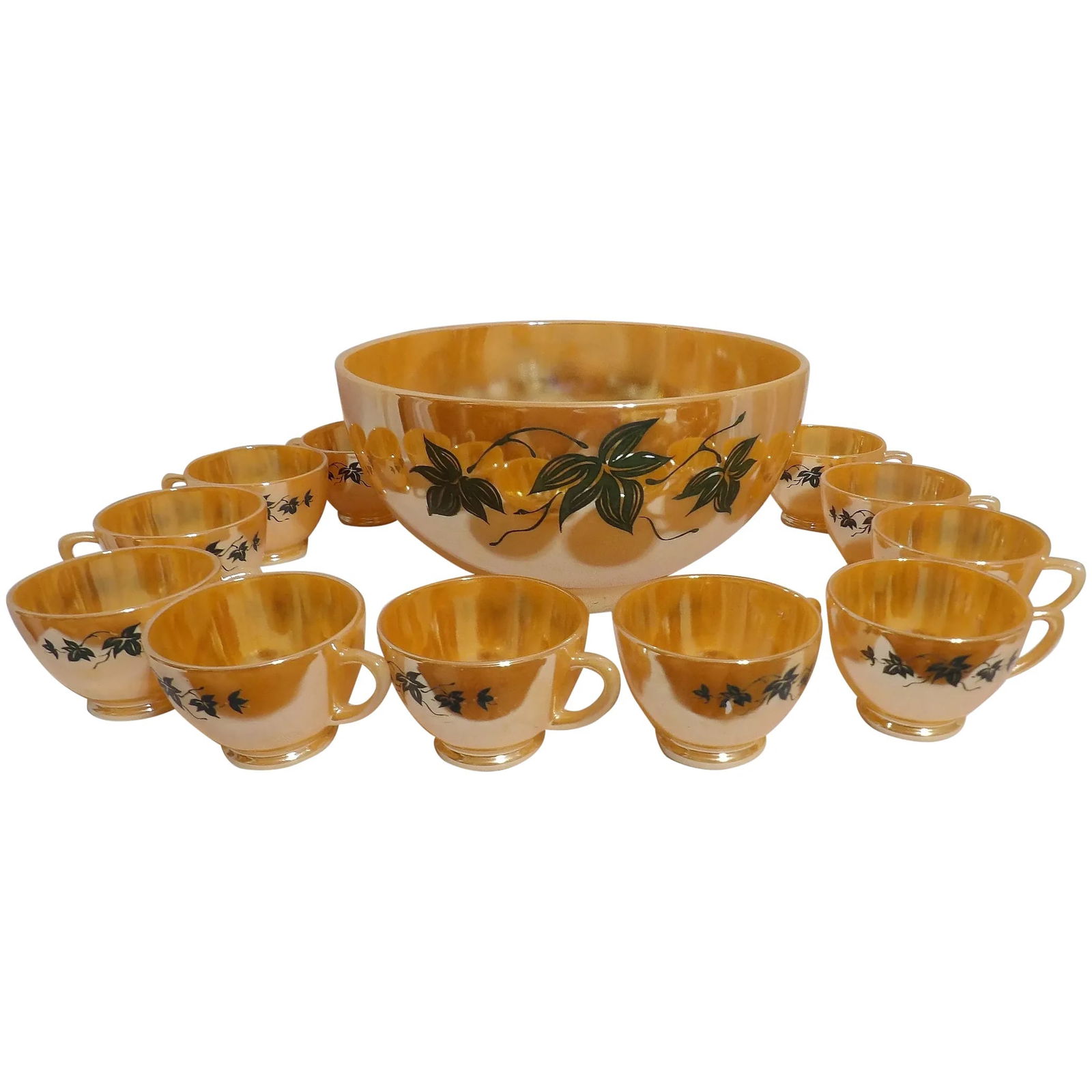 Vintage Anchor Hocking Peach Luster Egg Nog Bowl and Cups: This Vintage Anchor Hocking Peach Luster Egg Nog Bowl and Cups is in excellent condition. All items with the exception of one cup are in near MINT condition. Comes with 11 cups. Bowl measures 5 ¼