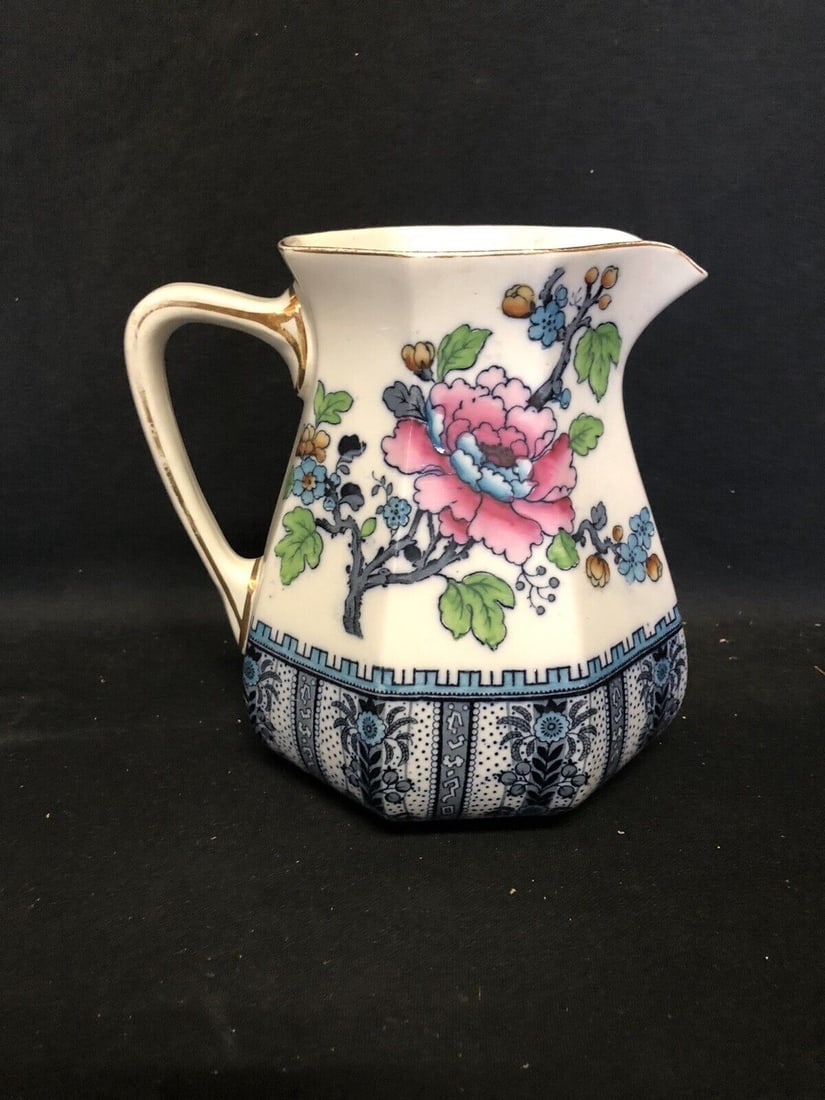 Flow Blue Pitcher: It is 7 3/8” high and is marked. It has no chips, cracks or repairs Shipping: Domestic: Flat-rate of $15.00 to anywhere within the contiguous U.S. International: Foreign shipping rates are deter