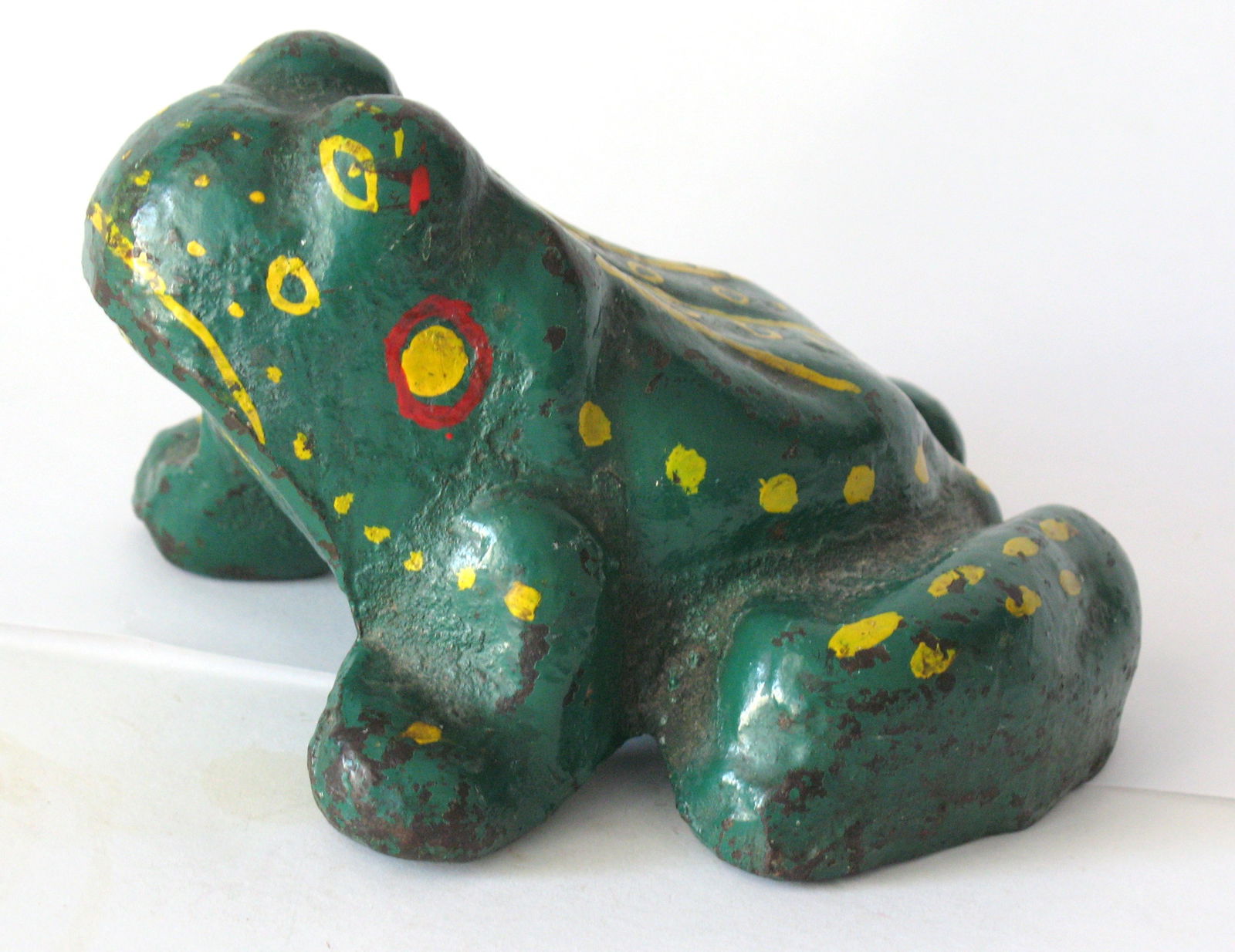 Antique cast iron whimsical frog doorstop: Title: Antique cast iron whimsical frog doorstop Date/Period: 1930's Dimension: 5” x 4 1/2” Additional Information: Nice antique cast iron whimsically painted frog door stop in great old p