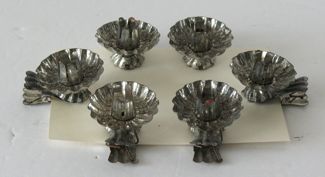 Group of antique tin Christmas tree candle clips. (1 of 4)