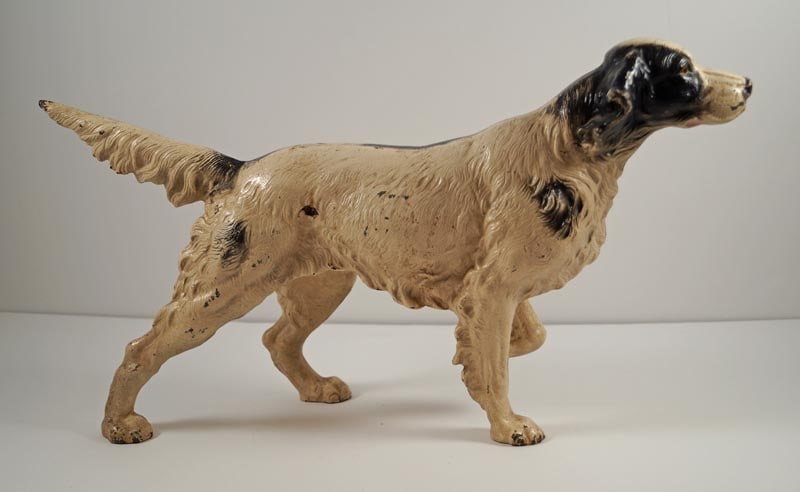 English Setter Dog Cast Iron Hubley Doorstop: Title: English Setter Dog Cast Iron Hubley Doorstop Dimension: 8 7/8” tall x 15 ½” long. Date: Circa 1930’s. Additional Information: Life-like casting of a full-figure Antique E