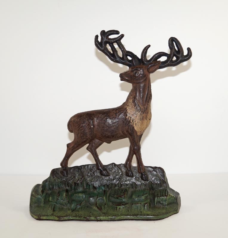 Antique Elk on Rocks Cast Iron Albany Doorstop: Title: Antique Elk on Rocks Cast Iron Albany Doorstop Dimension: 9 7/8” tall x 8 5/8” wide. Date: Ca. 1920’s. Additional Information: Wonderful picturesque casting of an Elk standing