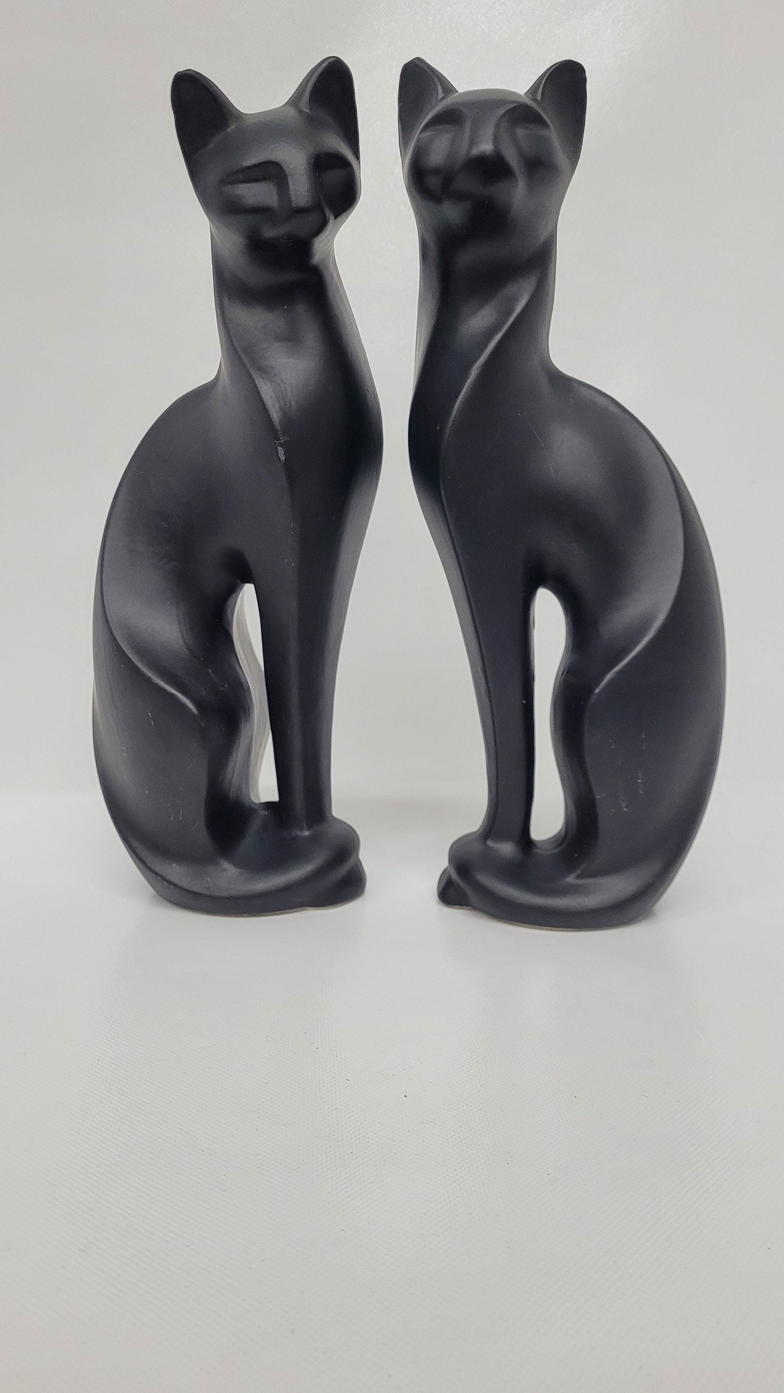 2 mid century black cats sculptural statues ceramic art pottery modern design: Vintage from the 1970s Materials: ceramic, pottery Width: 4 inches Height: 12 inches Depth: 3 inches Mid Century Pair of Black Cat Sculptural Statues Table Top Ceramic Art Pottery Modern Design A uniq