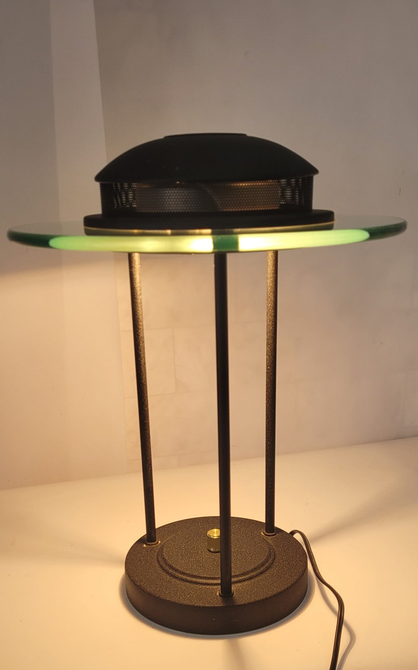 Vintage Post Modern Saturn bankers desk lamp in the style of Robert Sonneman Black with Glass Ring: Vintage from the 1980s Materials: glass, metal Width: 12 inches Height: 16 inches Depth: 12 inches This 1980 - 1990 Saturn bankers desk lamp is a copy of a desk lamp designed by Robert Sonneman. It wa