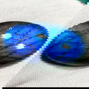 49.14 Ctz Natural Blue Labradorite: No Reserve! Title: 49.14 Ctz Natural Blue Labradorite Color/Clarity: Bluish / Semi Transparent Gemstone: Labradorite Carat Weights: 49.14 Size: 35.80 x 19.05 x 8.20 Additional Information: Oval Caboch