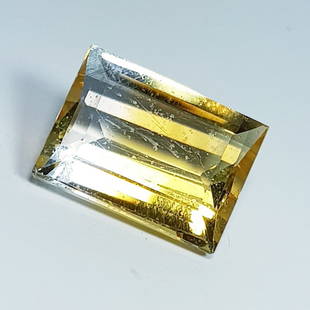 7.73 ctz " Collective Gem " Natural Bi Color Topaz: No Reserve! Title: 7.73 ctz " Collective Gem " Natural Bi Color Topaz Color/Clarity: Topaz Gemstone: Bi Color / IF Carat Weights: 7.73 Size: 14.20 x 10.80 x 6.40 Additional Information: Emerald Cut /