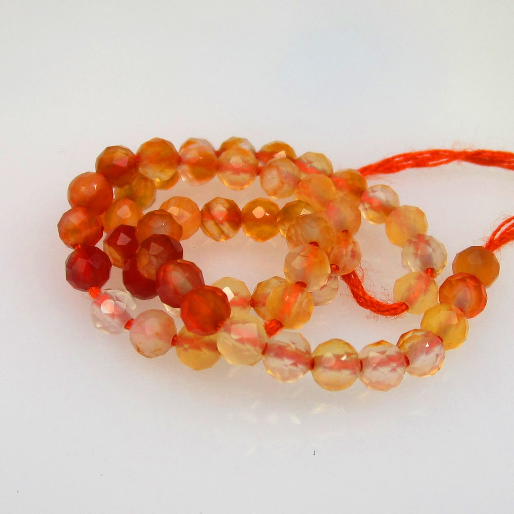 9.97 Ctw Natural 52 Orange Carnelian Round Beads: No Reserve! Title: 9.97 Ctw Natural 52 Orange Carnelian Round Beads Stone Clarity: Opaque Gemstone:Natural Carnelian Beads Carat Weights: 9.97 Size/Dimensions: 3.20 - 3.30 mm / 52 Pc's Additional Info