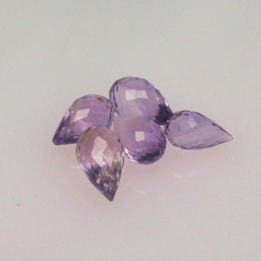2.36 Ctw Natural 5 Drilled Purple Amethyst Pear Drop Beads: No Reserve! Title: 2.36 Ctw Natural 5 Drilled Purple Amethyst Pear Drop Beads Stone Clarity: Transparent Gemstone:Natural Amethyst Beads Carat Weights: 2.36 Size/Dimensions: 6.0x3.3 - 7.0x3.9 mm / 5 P