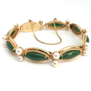 Jadeite Jade Cabochon Marquise Beats GIA 14k Gold Link Bracelet: Jadeite Jade Cabochon Marquise Pearl GIA certified 14k Yellow Gold Bracelet Jadeite Jade: 17.6 x 6.45 x 2.2mm Shape: Marquise Color: Green 16 Translucent White round beads Weight: 28.2 grams 