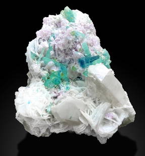 Nature's Gem Trio: Paraiba Tourmaline, Quartz, and Lepidolite Crystal Cluster: Condition: Natural Treatment: None Name: Tourmaline, Quartz, Lepidolite Weight: 1335 Grams Size: 125x140x85 Millimeter Shape: Specimen Reserve: $2,450.00 Shipping: Domestic: Free shipping to