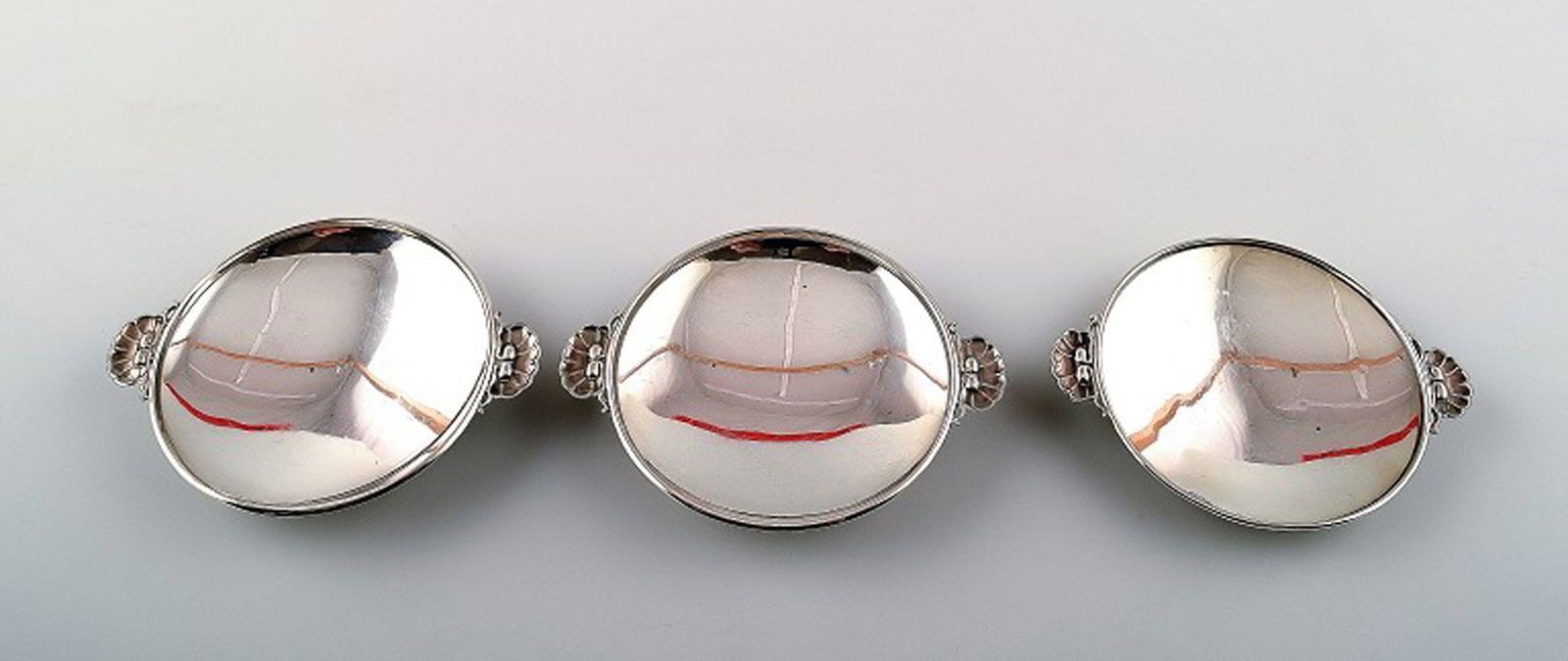 A collection of three Georg Jensen silver bowls with handles in the form of mussels. No. 355B. (1 of 5)