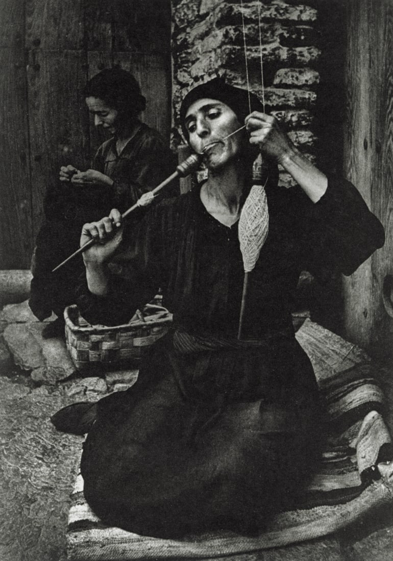 W. EUGENE SMITH - A Woman Spinning, Spain, 1951: Artist: W. Eugene Smith Title: A Woman Spinning, Spain, 1951 Medium: Sheet Fed Gravure, 1989, Switzerland Dimensions: 5.65x8.05" Description: Heat Wax Mounted on 8.5x11" Conservation Board Artist Bio: