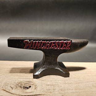 Cast Iron "Winchester" Miniature Anvil: 5 1/2" long x 2 1/2" Tall x 1 3/4" Wide A wonderful reproduction cast iron collectible advertising Winchester anvil. Advertising pieces like this many times were given to shops or used as sales sample