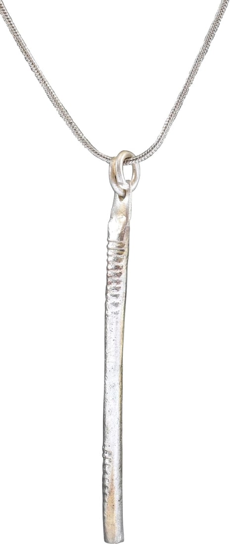 VIKING TUBULAR PENDANT NECKLACE, 9TH-11TH CENTURY AD: About 2 3/8" in length, of elegantly reeded cylindrical form. Closed butted seam at the side. With its original suspension ring. These were strung on necklaces along with beds and amulets to provide a
