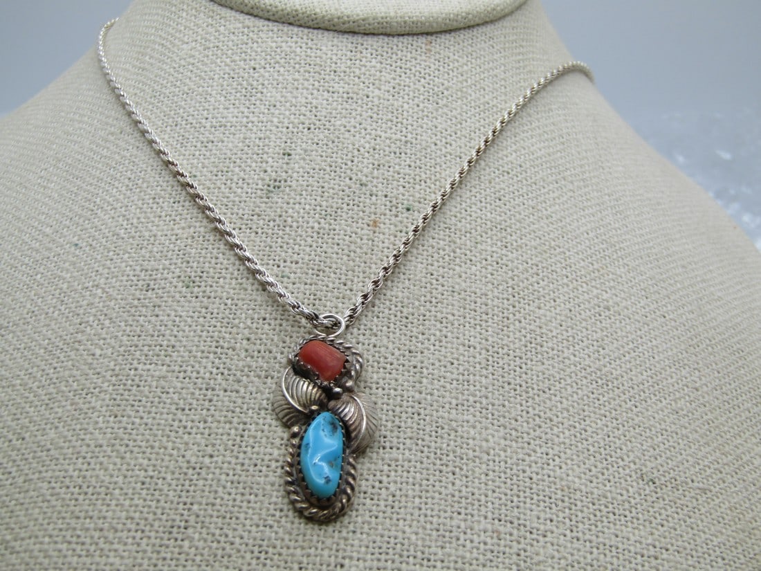 Vintage Sterling Southwestern Turquoise Coral Necklace, 20", Unisex: Vintage Sterling Southwestern Turquoise Coral Necklace, 20", Unisex. This has sawtooth bezel set turuoise and red coral nugget with two feather accetns and a rope accent around the stones. Length of t