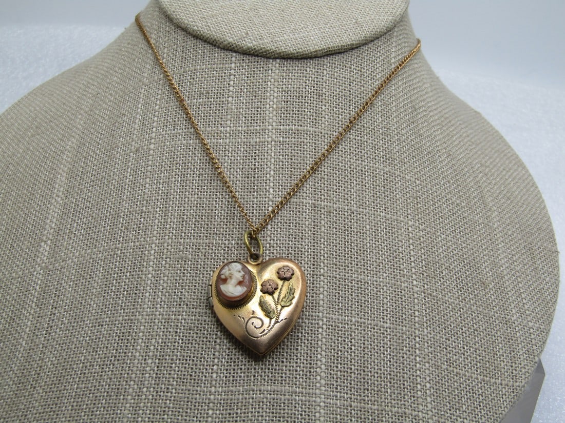 Vintage Cameo Heart Floral Locket Necklace, Gold Filled, 1930's, 14": Vintage Cameo Heart Floral Locket Necklace, Gold Filled, 1930's, 14". This is marked gold filled and has a raised bezel-set cameo on the upper left of the heart with raised rose gold and yello gold fl