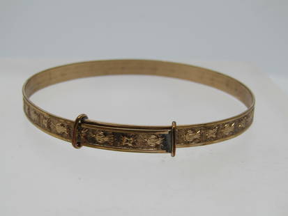 Vintage 10kt G.F. Egyptian Floral Slide Bangle Bracelet, 6.5"-7", 1800's-Early 1900's: Vintage 10kt G.F. Floral Slide Bangle Bracelet, 6.5"-7", 1800's-Early 1900's. the raised flowers and symbols have an Egyptian look and theme. The bracelet is appx. 5mm wide. It has raised edges with a